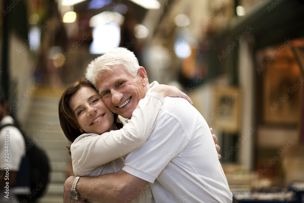 Close-up of a happy married couple hugging. Close-up of a happy married couple hugging.