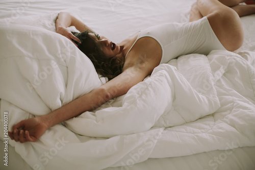 Woman in white bed