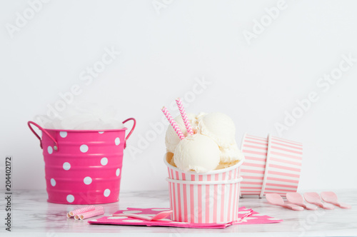 vanillia ice cream in a pink styled setting photo