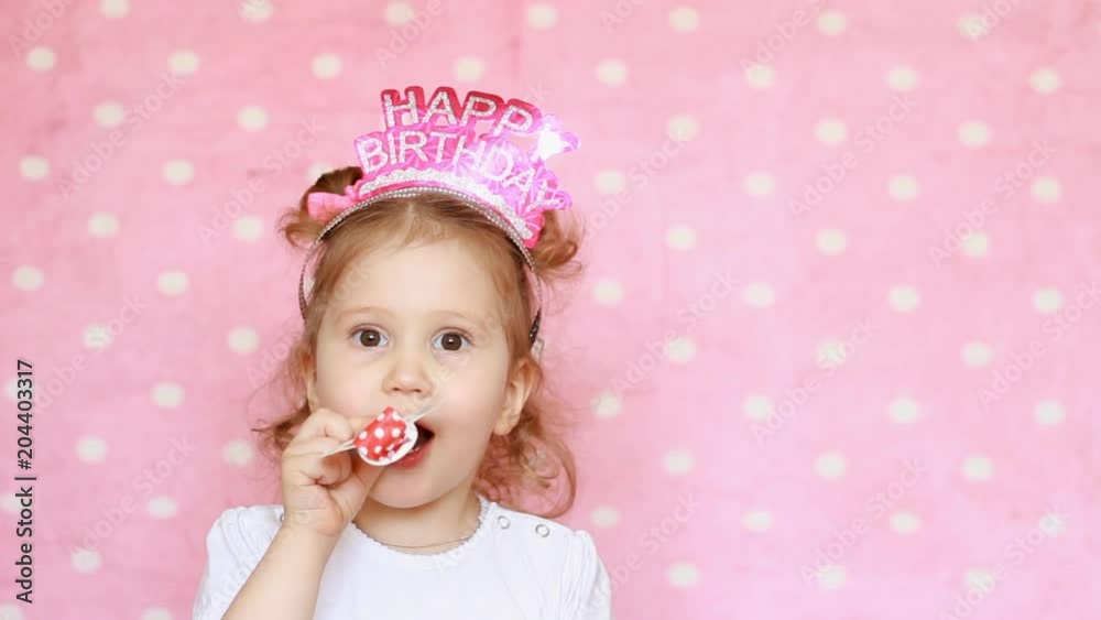 Birthday. Happy child girl blow horn and smiling. Birthday. Happy child girl blow horn and smiling.