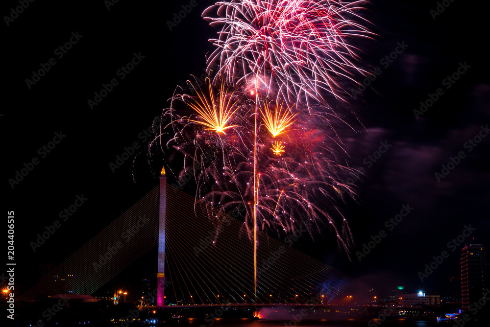 Beautiful colorful firework display for celebration happy new year and merry christmas in the night sky, bangkok city, thailand