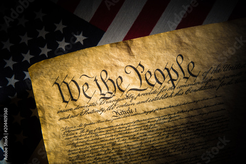 Canvastavla A copy of the Constitution of the United Sates of American on a flag of the USA