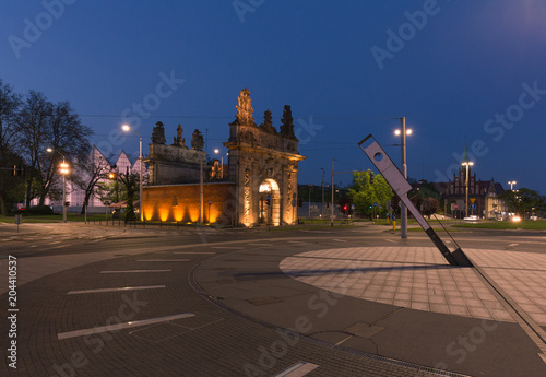 night view of the historic port gate in Szczecin.