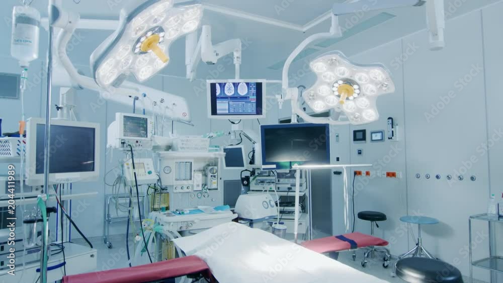 Establishing Shot of Technologically Advanced Operating Room with No People, Ready for Surgery. Real Modern Operating TheaterWith Working Equipment. Shot on RED EPIC-W 8K. Establishing Shot of Technologically Advanced Operating Room with No People, Ready for Surgery. Real Modern Operating TheaterWith Working Equipment. Shot on RED EPIC-W 8K.