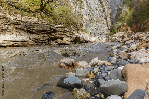 Stormy river in a mountain gorge photo