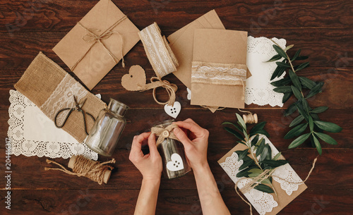 Diy creative  idea. Handmade card invitation. Wedding card invitation on wooden table. Flat lay photo