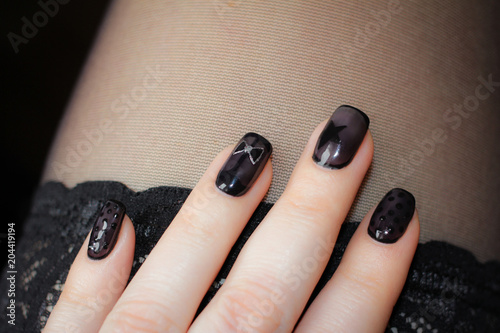 Designer nails in tone stockings. photo
