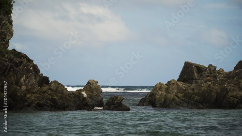 Swimming surfers in open sea with beautiful swell waves. Education surfers in the ocean with big waves. Active sport leisure in Pacific Ocean.Philippines, Puraran,Catanduanes. Travel concept.