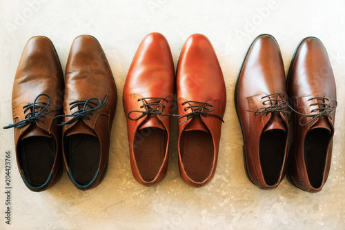 Men shoes collection - different models and brown colors. Top view. Sale and shopping concept