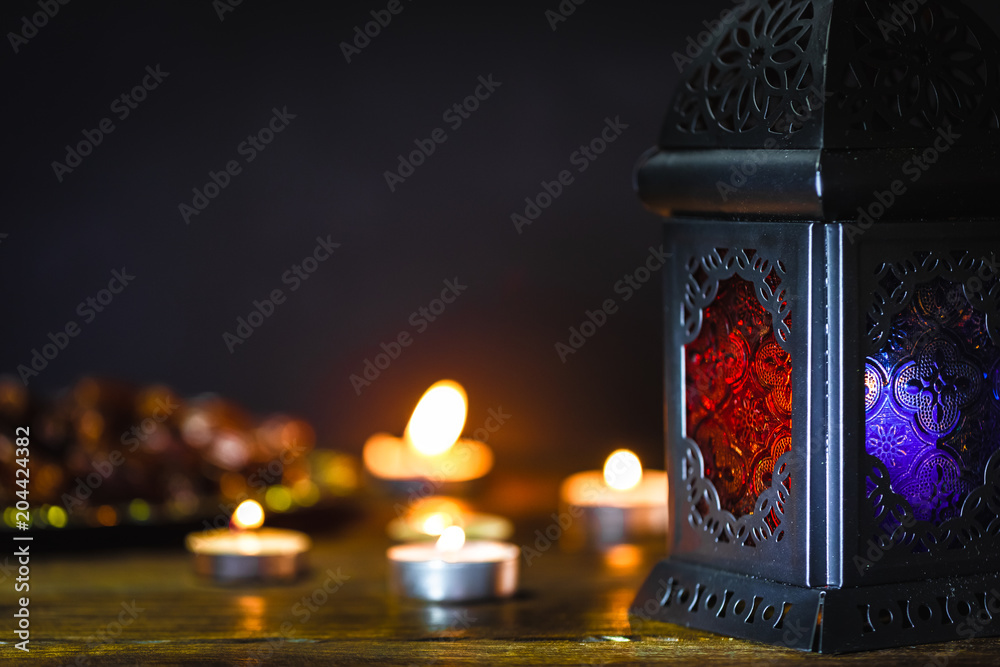 Naklejka premium The Muslim feast of the holy month of Ramadan Kareem. Beautiful background with a shining lantern Fanus. Free space for your text.