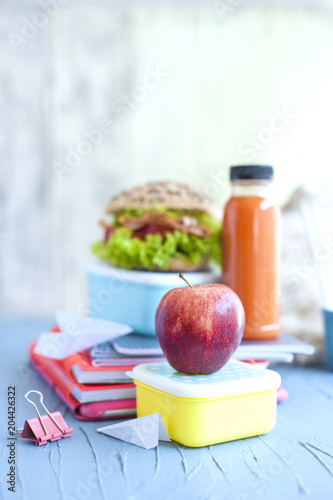 School lunch and school notebooks. Place for text.