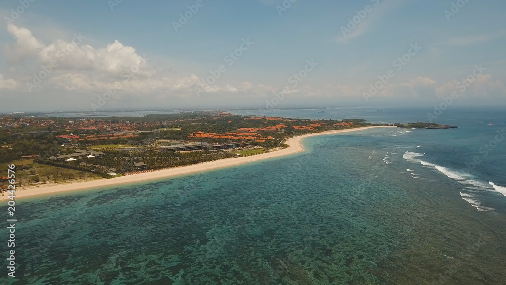 Aerial view of beautiful beach, hotels and tourists, Pura geger, Nusa Dua, Bali, Indonesia. Seascape, beach, ocean sea Travel concept
