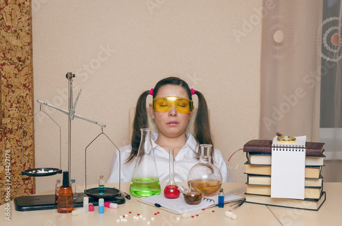 Emotional student girl on chemistry lesson. Pharmacist or apothecary woman. Scientific experiment background. Funny intern in chemical laboratory concept.