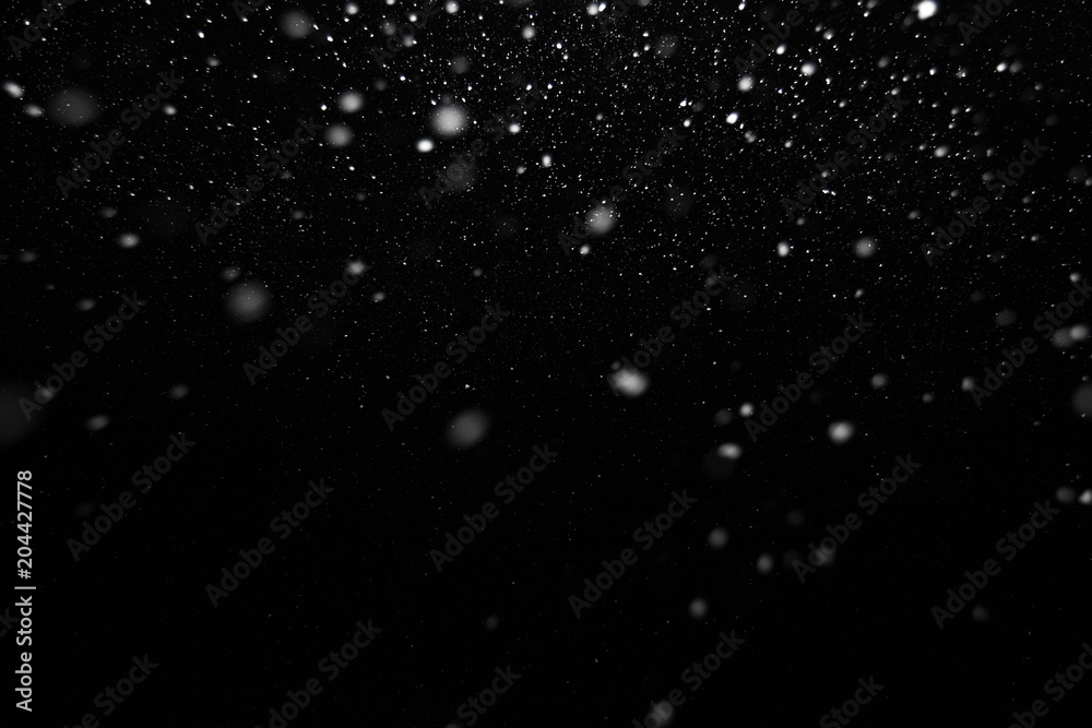 white snow on a black background