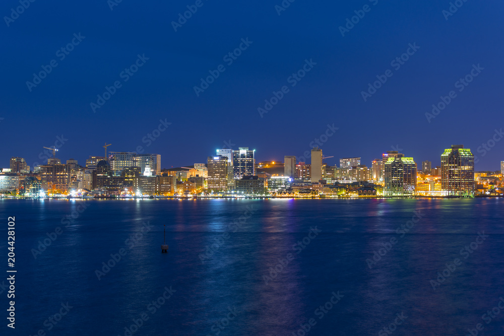 Halifax City skyline at night from Dartmouth waterfront, Nova Scotia, Canada.