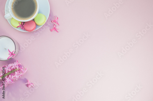 Flat lay photo of coffee cup with flowers
