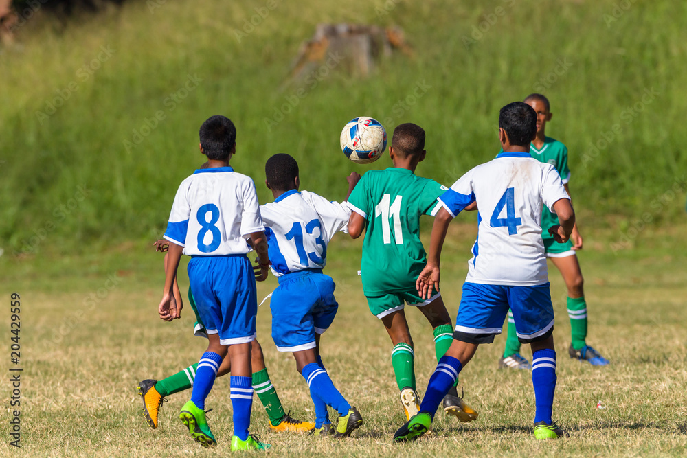 Obraz premium Football Soccer Junior Players Ball Action