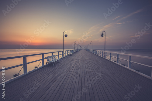 Obraz na płótnie Amazing colorful sunrise over the pier in Gdynia Orlowo. Sunrise over the sea. w salonie