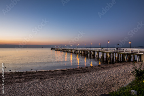 Amazing sunrise on the pier at the seaside. Gdynia Orlowo  Poland