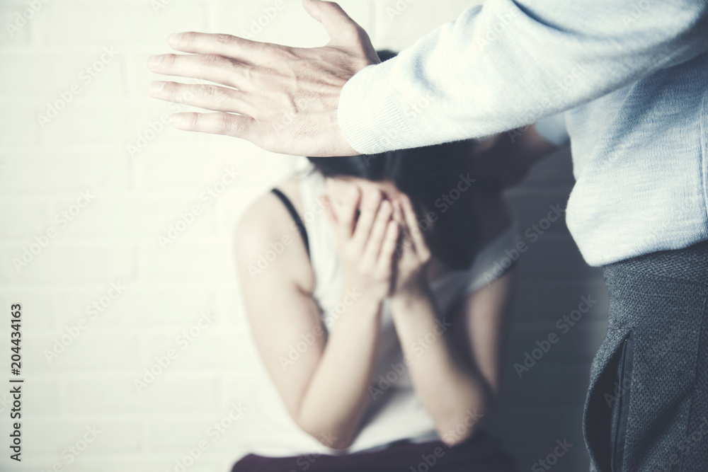 Man beating up his wife in bed Man beating up his wife in bed