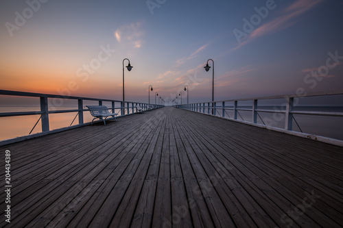 Amazing colorful sunrise over the pier in Gdynia Orlowo. Sunrise over the sea. © R_Szatkowski