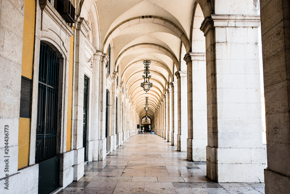 typical covered walkway, the portico of placa do comercio, lisbon