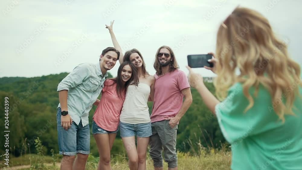 Happy Friends Taking Photos On Phone In Nature. Happy Friends Taking Photos On Phone In Nature.