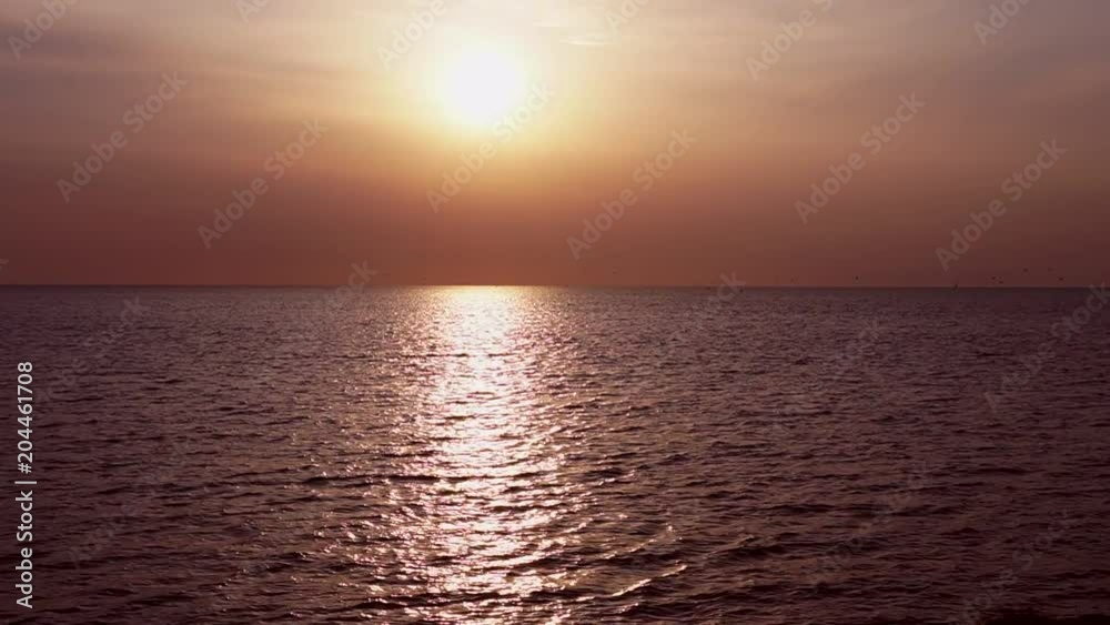 Sunset sea landscape with clouds and waves