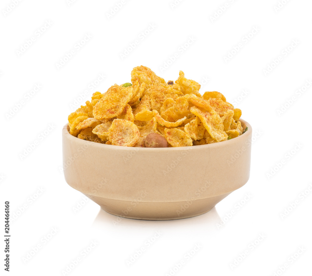 Indian Deep Fried Salty Dish Namkeen Called Namkin, Nimco, Chivda, Mixture or Farsan made of gram flour and mixed with dry fruits isolated on white background Indian Deep Fried Salty Dish Namkeen Called Namkin, Nimco, Chivda, Mixture or Farsan made of gram flour and mixed with dry fruits isolated on white background