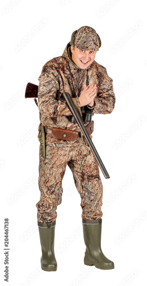 Full length portrait of a male hunter with double barreled shotgun Isolated on white background. hunting and people concept