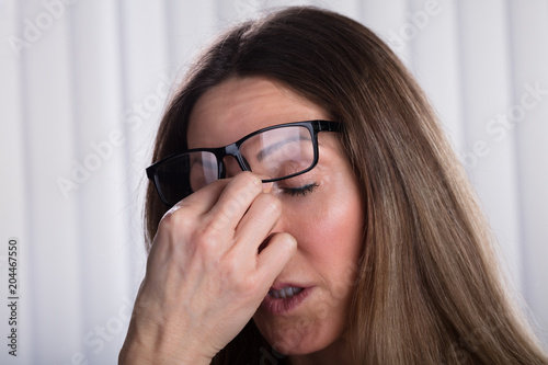 Woman Covering Her Eyes With Hands