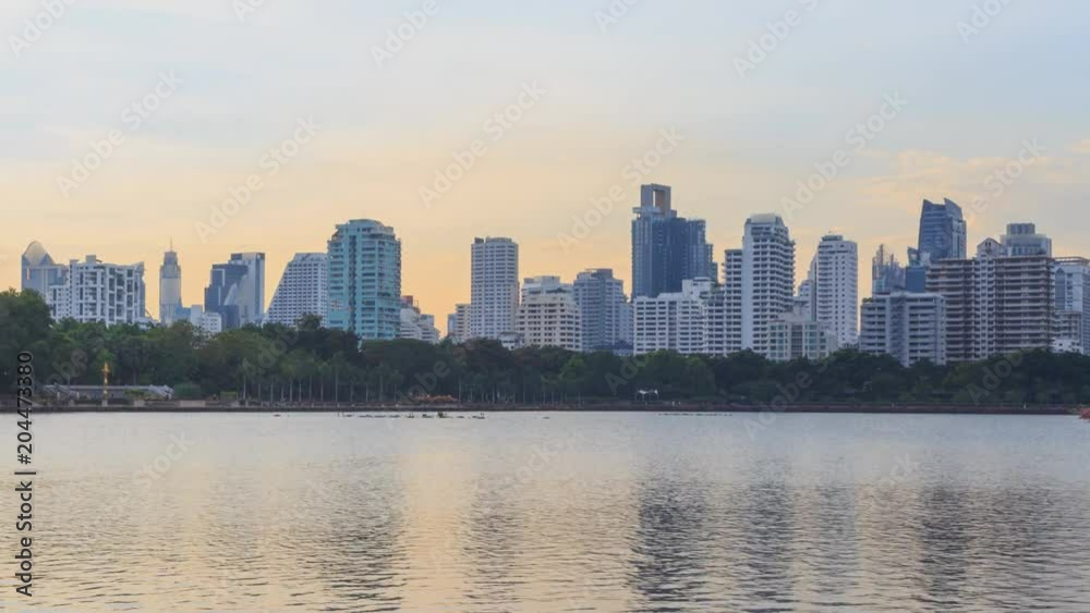 Time lapse Lake view with reflections of the city / high building in the city lake view