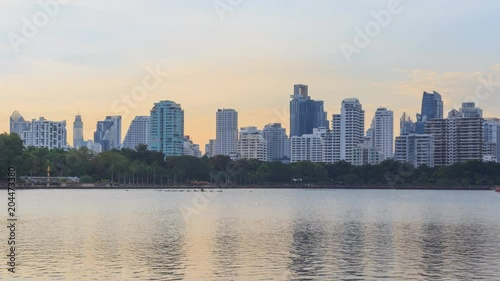 Time lapse Lake view with reflections of the city / high building in the city lake view