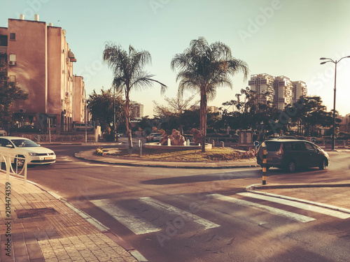RISHON LE ZION, ISRAEL -APRIL 23, 2018: Cars on the road on a sunny day in Rishon Le Zion, Israel.
