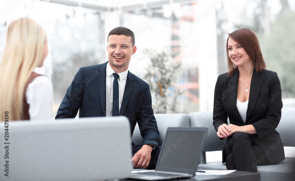 business team discussing business issues in office business team discussing business issues in office