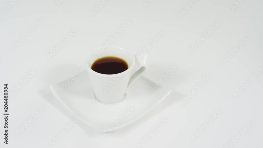 Putting a cookie next to a coffee cup Putting a cookie next to a coffee cup
