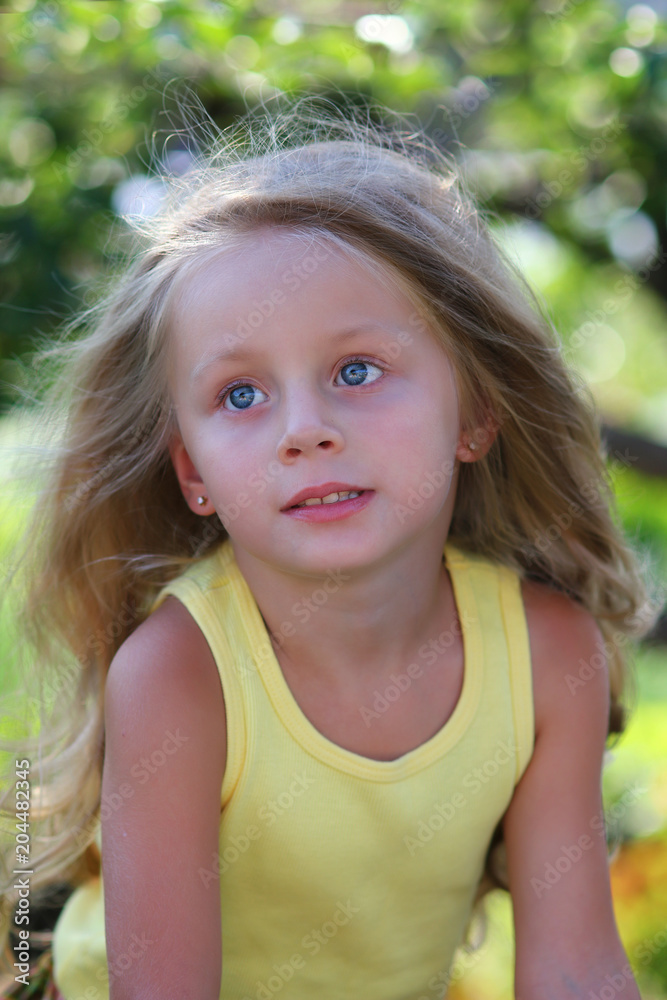 A close up portrait of a beautiful young girl with blue eyes A close up portrait of a beautiful young girl with blue eyes