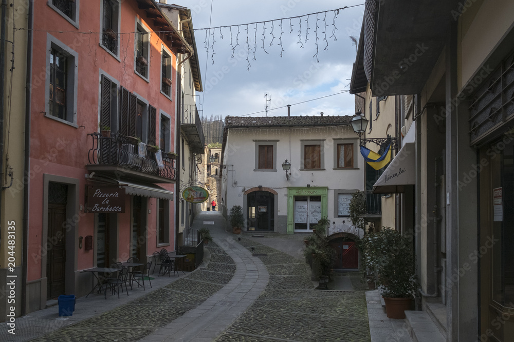 Obraz premium CASTELNUOVO DI GARFAGNANA, ITALY - FEBRUARY 2018;A street in Castelnuovo Di Garfagnana, Italy