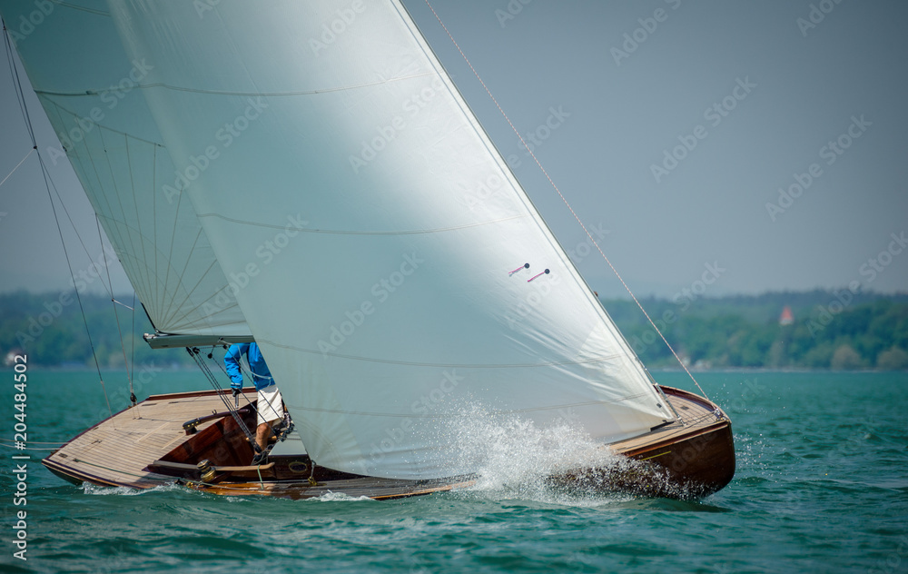 Classic sailing boats racing at a regatta at lake constance Classic sailing boats racing at a regatta at lake constance