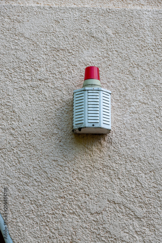 alarm siren at a wall