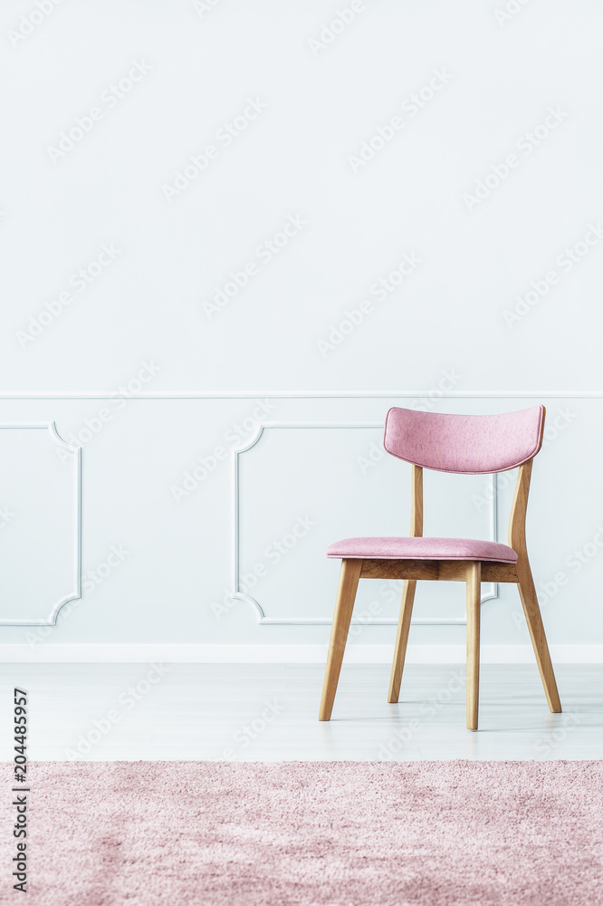 Pink chair in room Pink chair in room