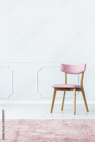 Pink chair in room