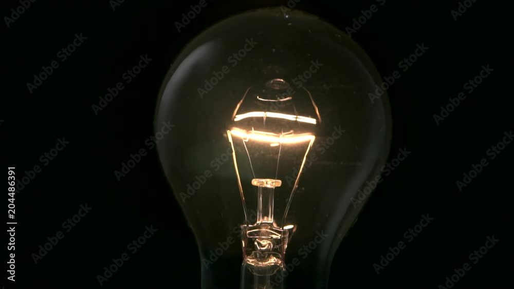 Light bulb turning on and off. 4k