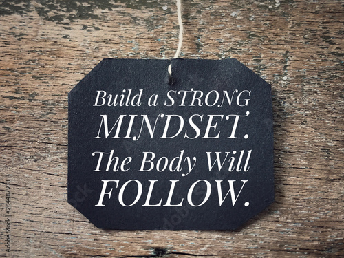 Motivational and inspirational quote - Build a strong mindset. The body will follow. With vintage styled background. photo