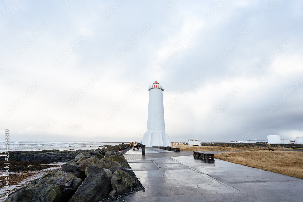 Old lighthouse in Iceland on the edge of the cliff