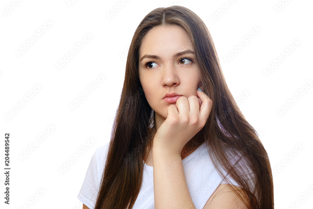 beautiful young woman on a white background, serious look, thinks, meditates beautiful young woman on a white background, serious look, thinks, meditates