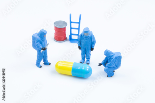 pharmacist scientists check quality drug capsule