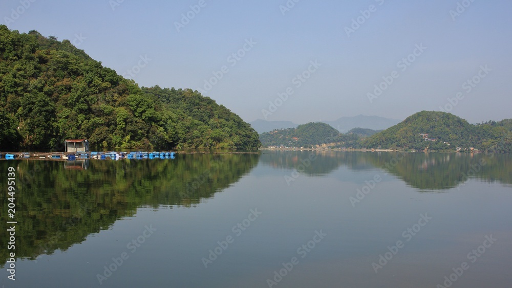 Green forest at the shore of lake Begnas, Nepal. Green forest at the shore of lake Begnas, Nepal.