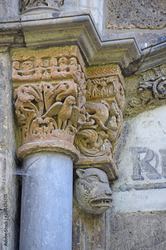 The left chapiter of the portal of the Church of St. Mary of Lizkirchen is decorated with beautiful and ancient stone carvings. Cologne, Germany, August 2017.