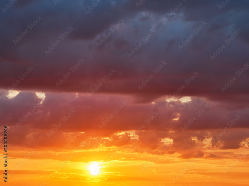 Fototapeta premium Bright orange and yellow colors sunset sky